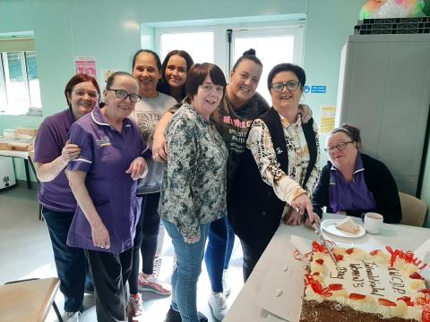 Sylvia cuts the International Women's Day cake